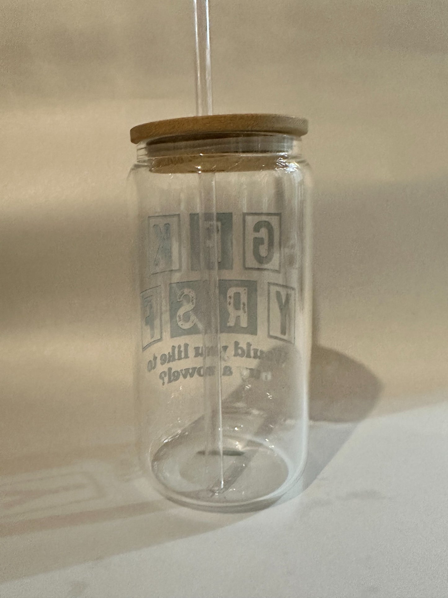 Back view of block-letter design on 15oz Libby glass with straw inserted.