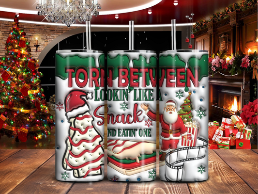 Torn Between Lookin’ Like a Snack & Eatin’ One – Funny Christmas 20oz Tumbler with Santa & Treats